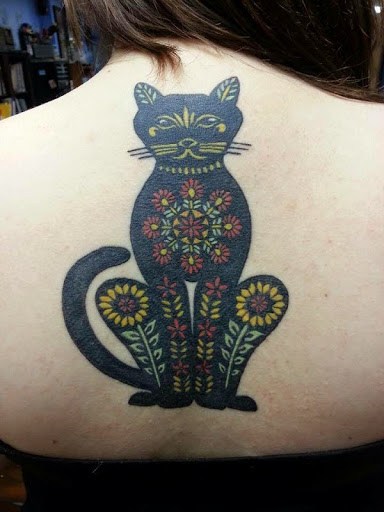 cat tattoo with flowers on the back