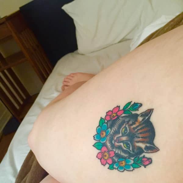 cat face and flower tattoo