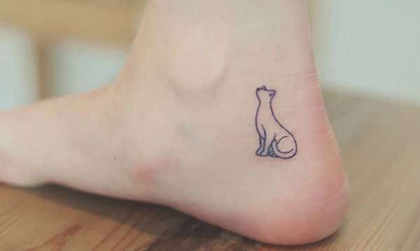 small cat outline tattoo