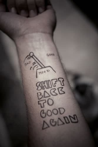 text tattoo on arm