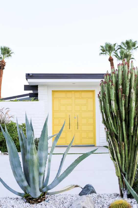 White color house with yellow door
