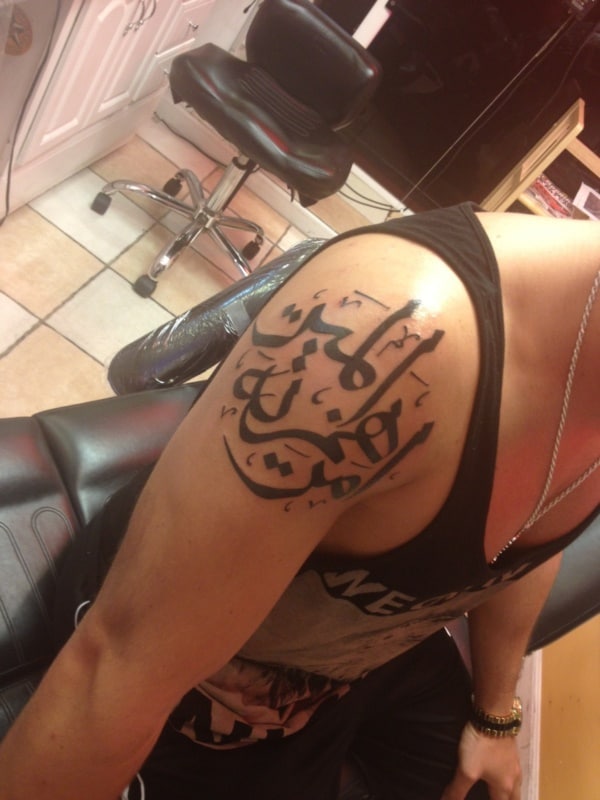 Holy scripture tattoos on arm
