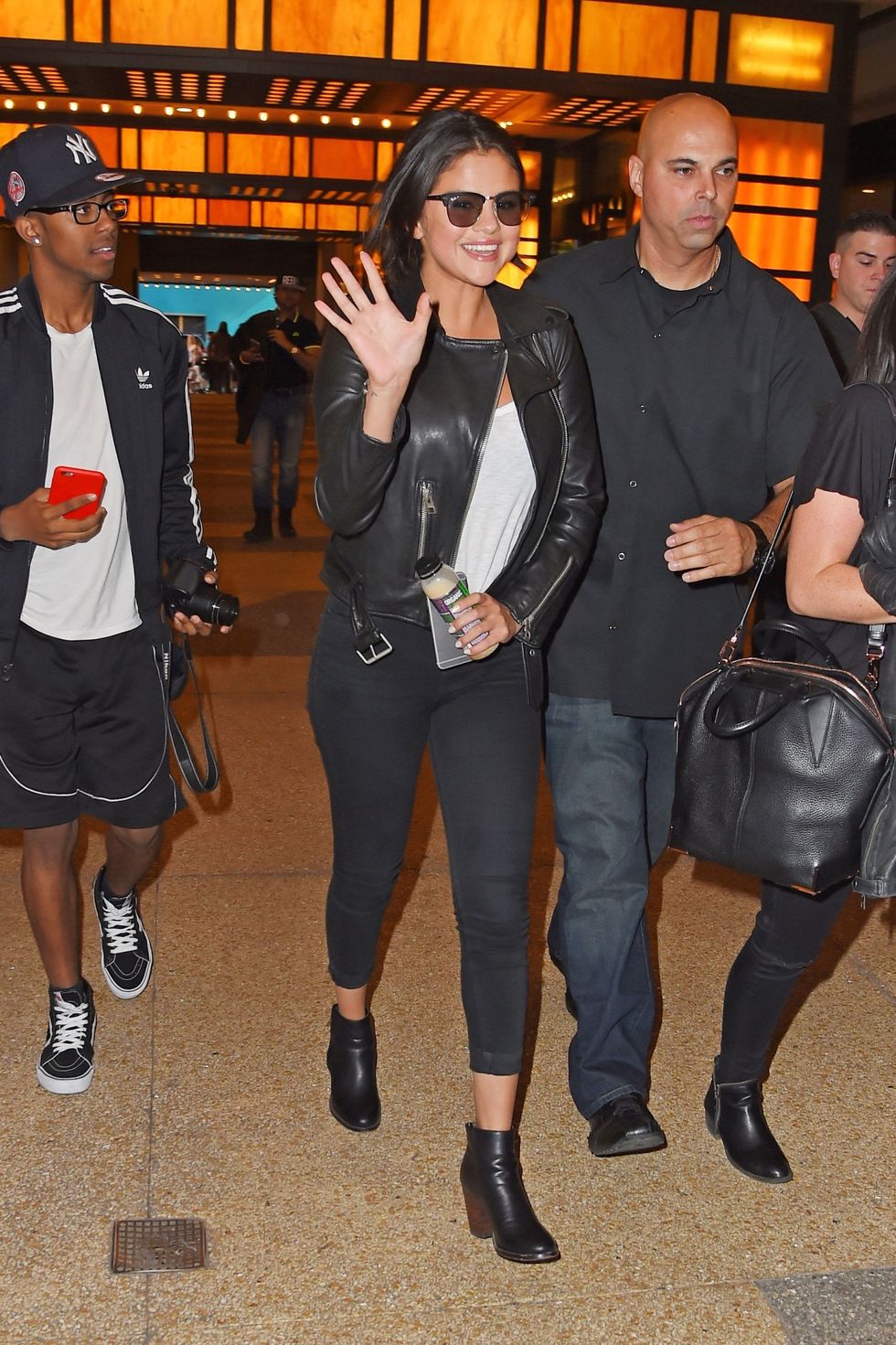 Selena gomez with leather jacket and black denim