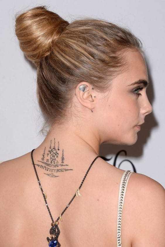 Cara Delevingne back Tattoo