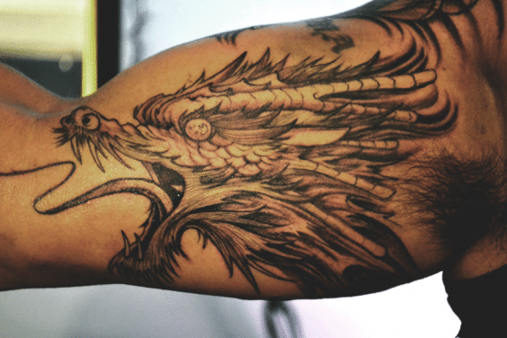 wrap around arm dragon tattoo