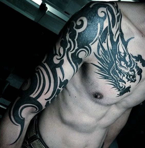 tribal dragon tattoo on men's chest