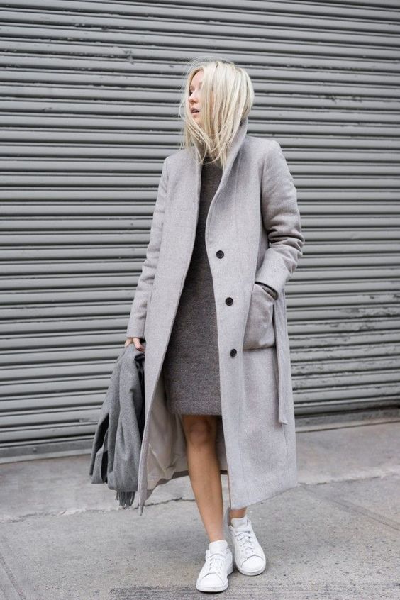 Model look woman with a simple looking dress, grey coat and cool sneakers