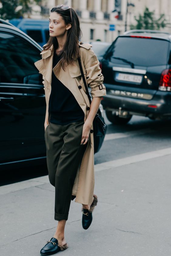 woman with brown coat and Black Shirt, Cropped Pants and Slide-On Shoes