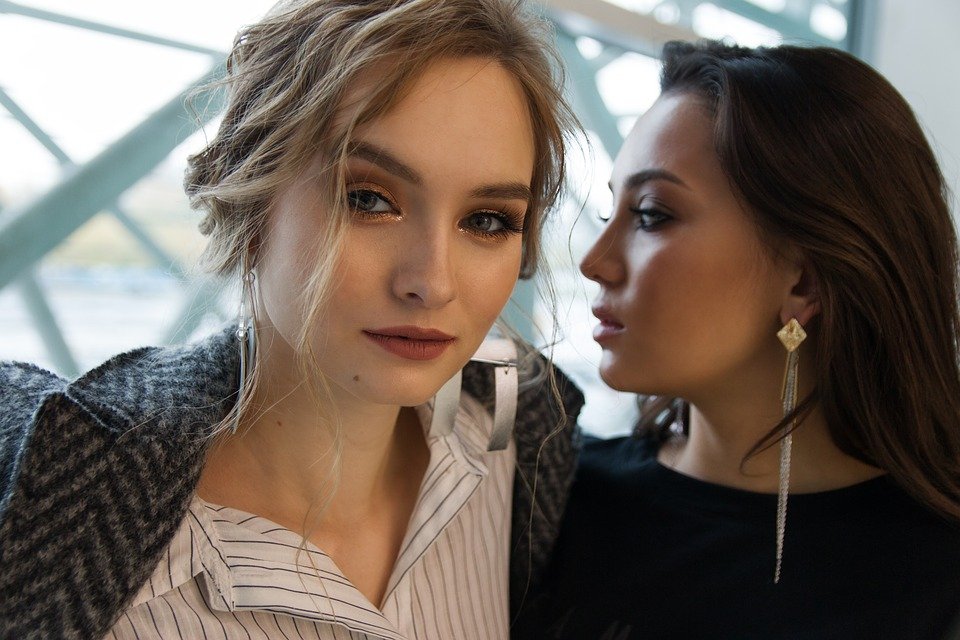 2 woman with the right earrings