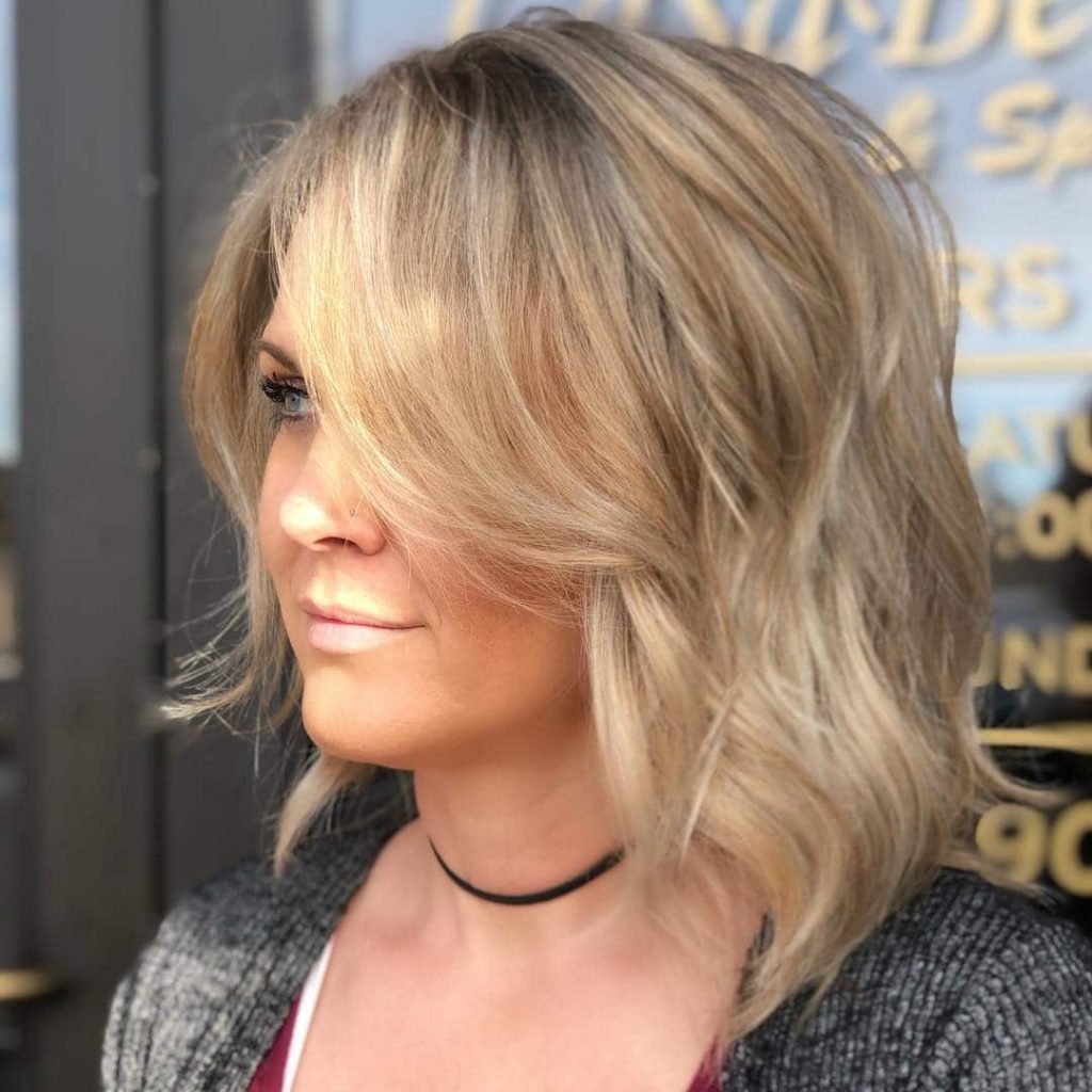 Medium Length hairstyle with side swept bangs
