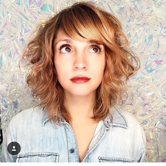 Medium curly hair with Side Swept Bangs