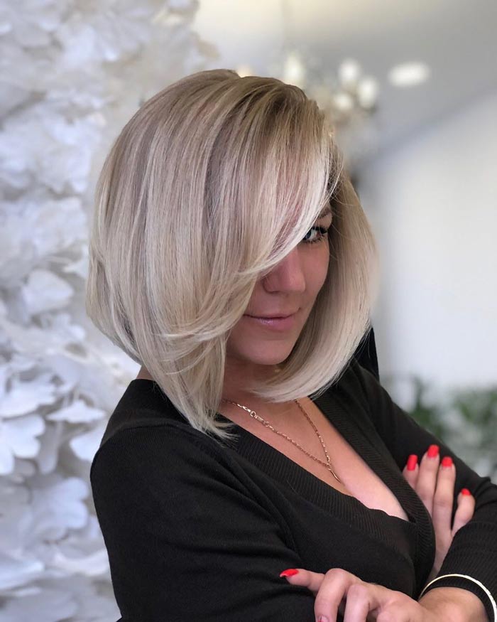 Side-Swept Feathered Bang Hairstyle