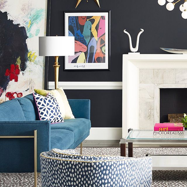 Black accent wall combination around fireplace.