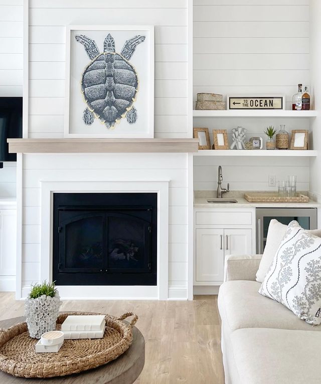 White Shiplap Wall Panels Around Fireplace