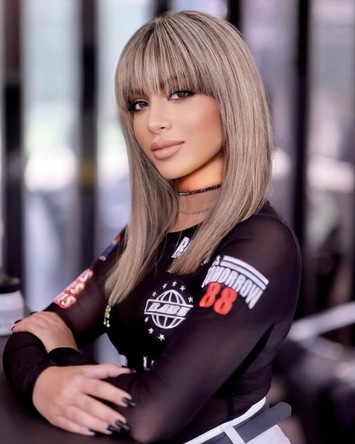 Mid Length Cut with Blunt Bangs for a Square Face