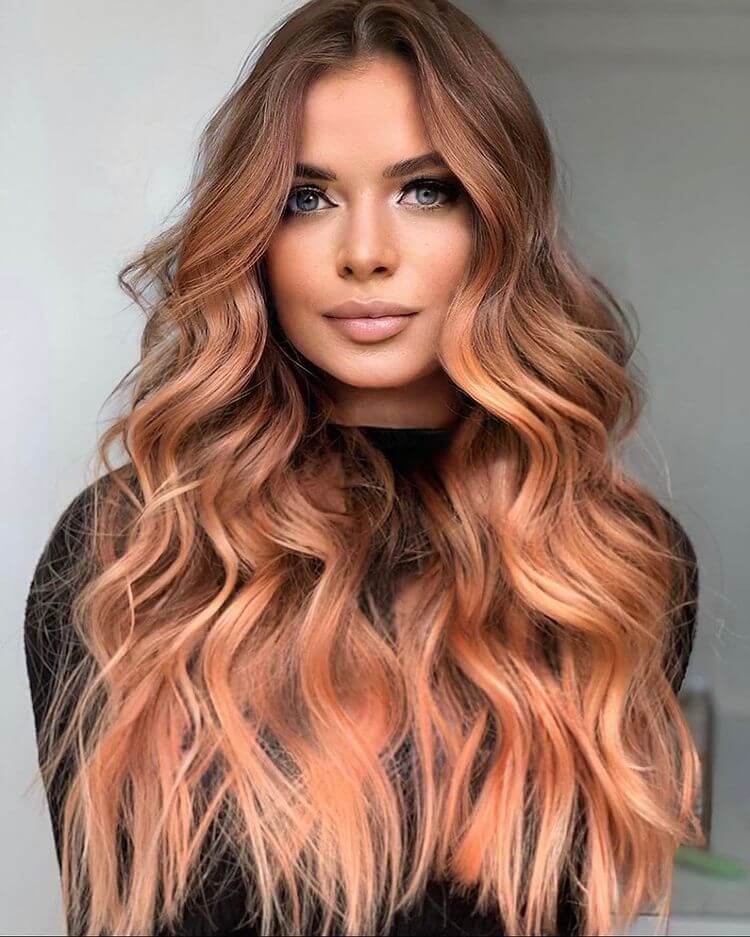 stylish Brown Roots with strawberry blond hair