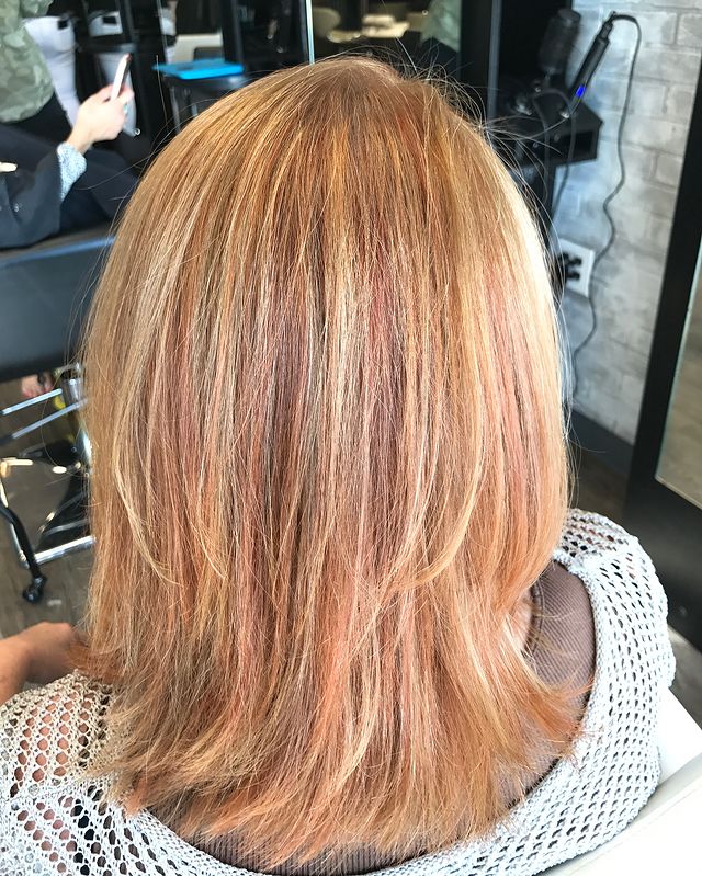 Medium Length Blonde Hair with Subtle Red Highlight