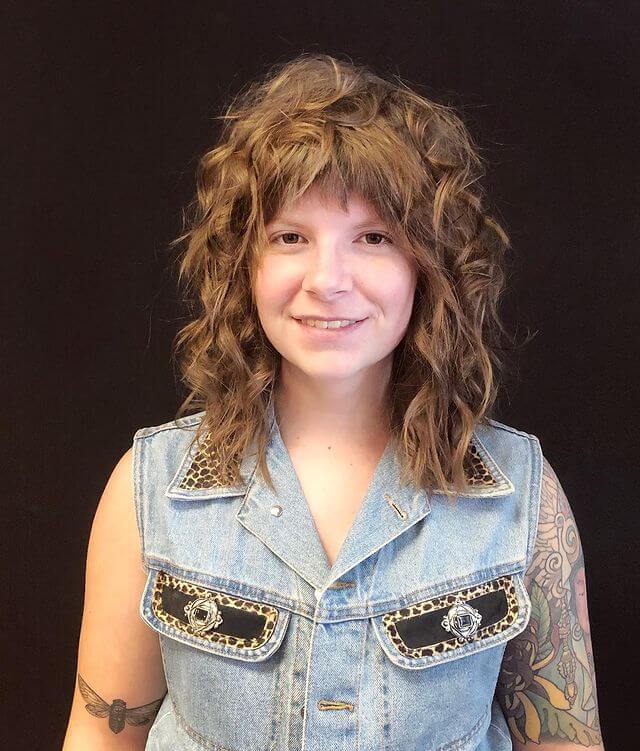 Rock n roll hairstyle with feathered bang