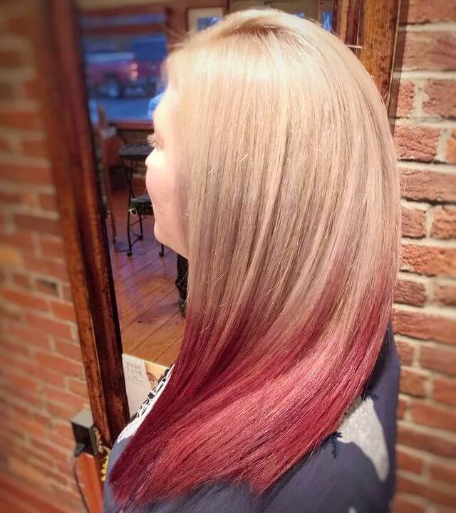 Seamless Transition Between Blonde and Red Haircolor