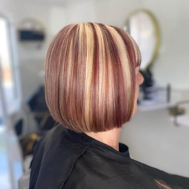 Short Blonde Bob Hairstyle with Red Wine Highlight