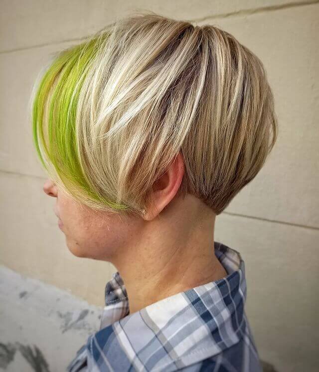 50 plus woman with short bob and green front highlight