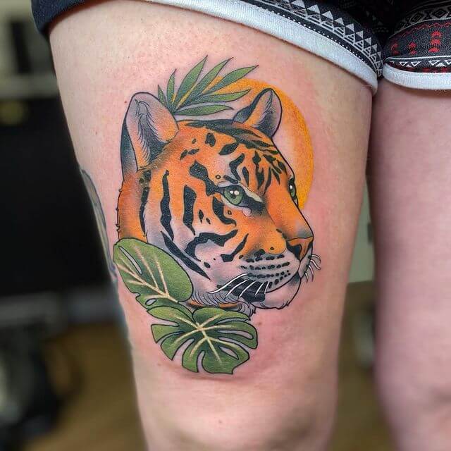 Bold Coloring Tiger Head tattoo on thigh