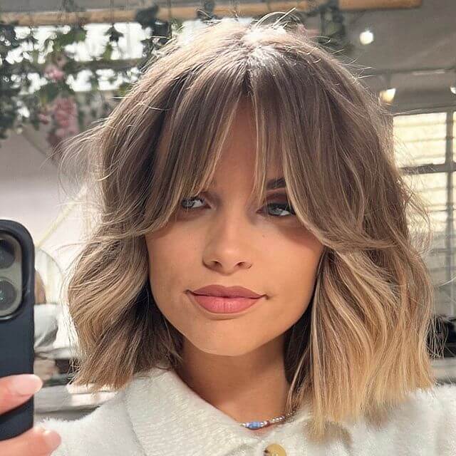 Women haircut with Dimensional Bob and Feathered Bangs