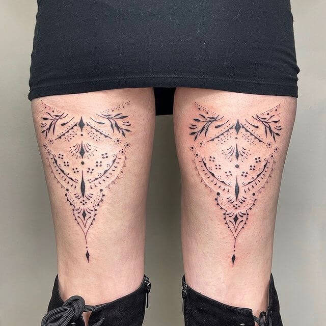 Lace tattoos on thigh
