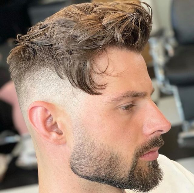 Men's short layered haircut with fade