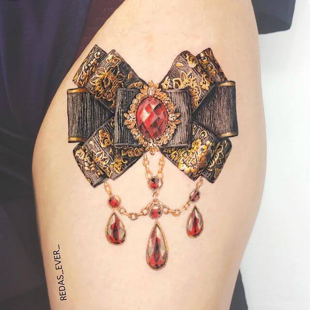 Ribbon Thigh Tattoo