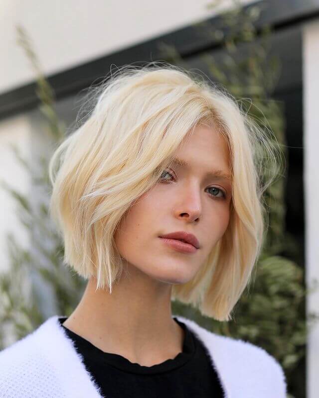 women with Modern Short Haircut and Center Part