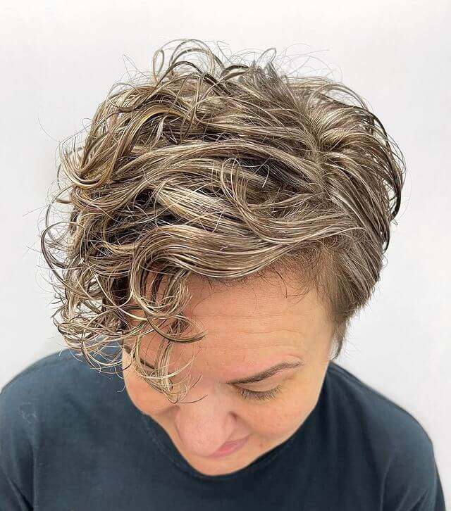 Short Curly Haircut with Bright Highlights