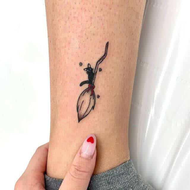 small jiji anime tattoo on ankle