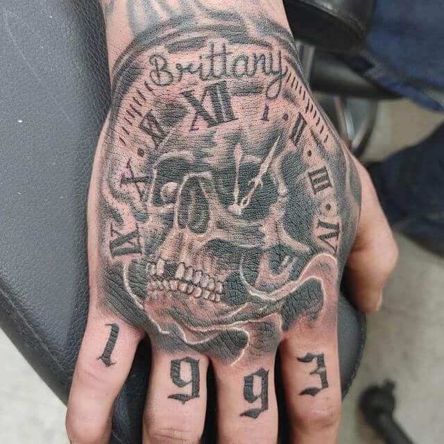 Skeleton Clock Hand Tattoo