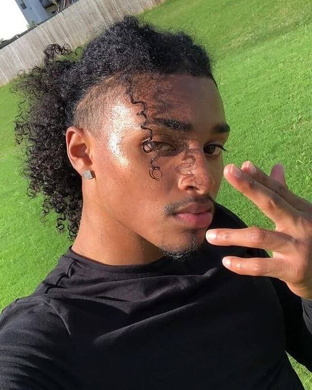 black men's curly ponytail