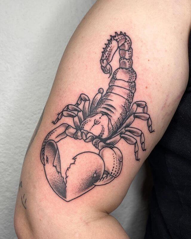 A Scorpian Playing with Broken Heart Tattoo