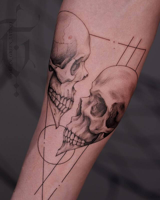 A skull in Broken heart tattoo