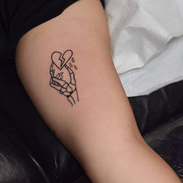 Broken Heart With Skeleton Hand Tattoo