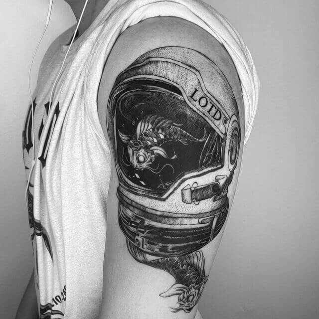 Astronaut Helmet and Fish Tattoo