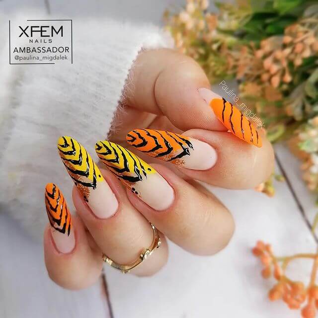 orange nails with animal prints