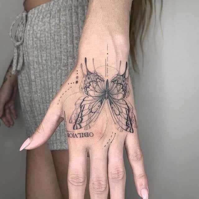 butterfly on hand tattoo for woman