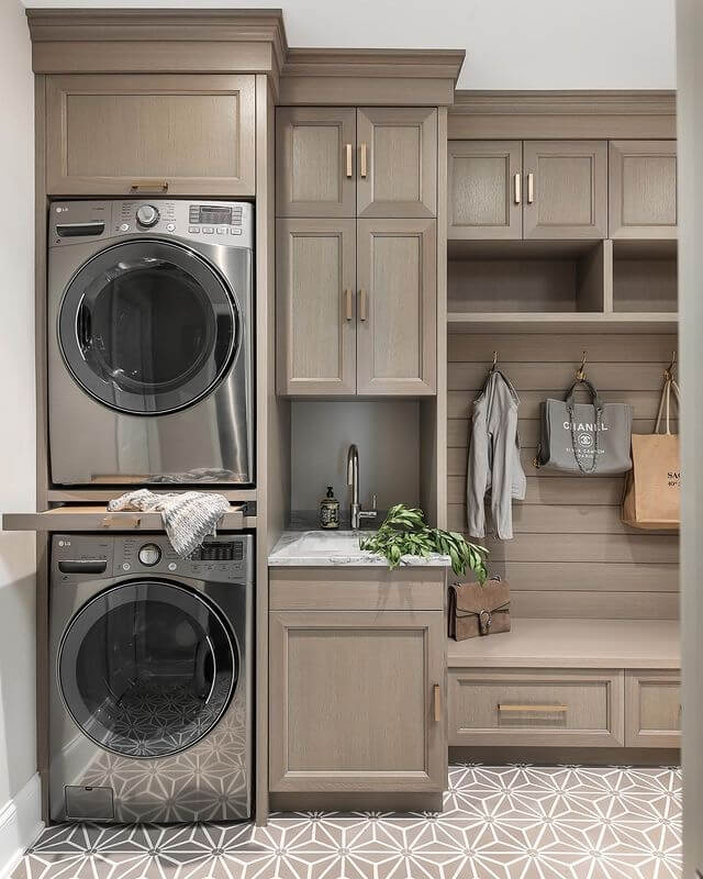 farmhouse washer room with functional cabinets