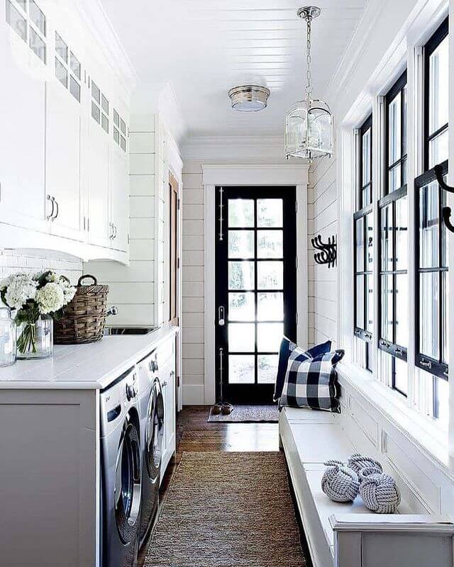 Black and White laundry room with Long Window Seat