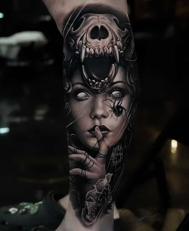 spider on woman face tattoo