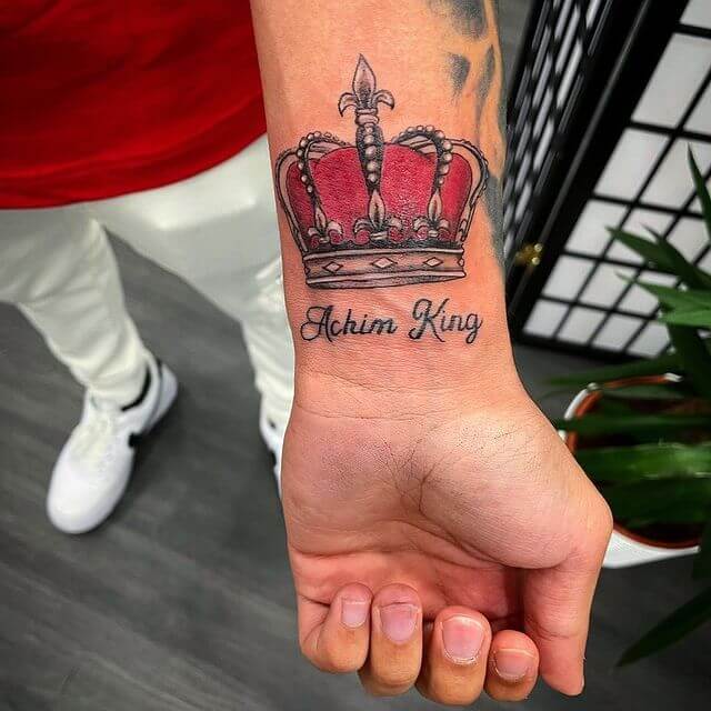 Black and red king crown tattoo