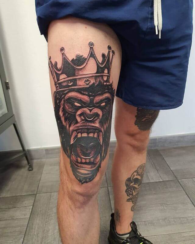 Monkey with crown tattoo