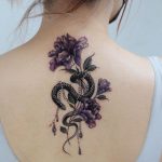snake and flower back tattoo