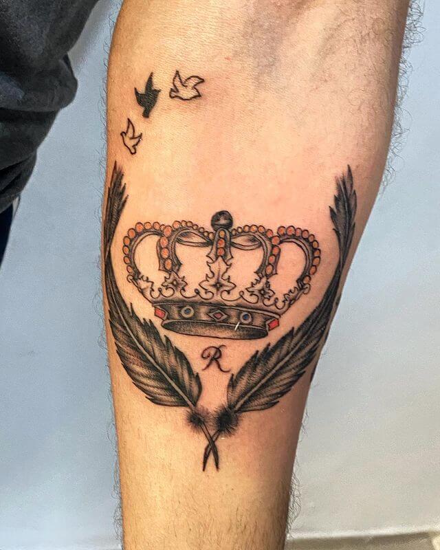 Crown and wings tattoo