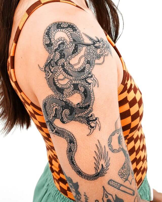 Black wave pattern dragon tattoo