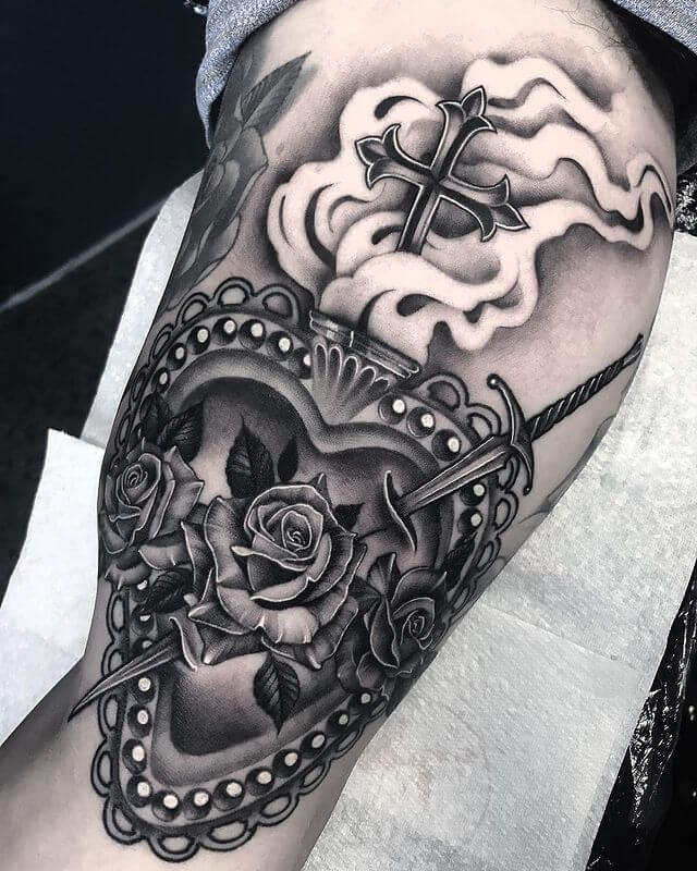 Dagger through heart tattoo